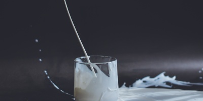 Glass of spilt milk. Photo by Anita Jankovic via Unsplash