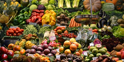 Image of a large vegetable stall in barcelona. Photo by Jacopo Maia via Unsplash
