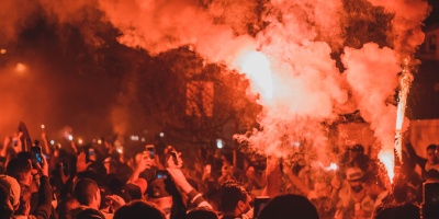Image of a riot at night. Photo by Maurício Mascaro via Pexels.