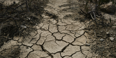 Photo of cracked and dry soil in a field. Image by engin akyurt via Unsplash