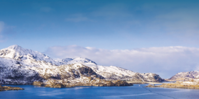 Image: Front cover of Feedback’s report titled “Blue Empire” showing aquaculture farms in a mountainous lake