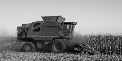 Photo of a combine harvester in black and white. Credit Alex Rusin via pexels