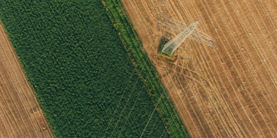 birds eye view of field and pylon, Max Bottinger via Unsplash