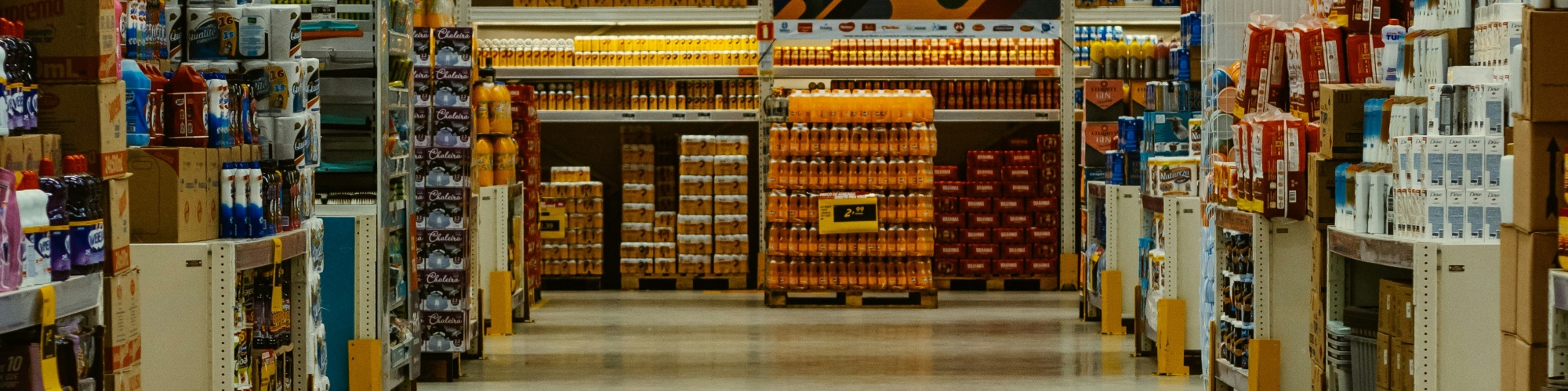 Shelves of food in a grocery store. Photo by Eduardo Soares via Unsplash.