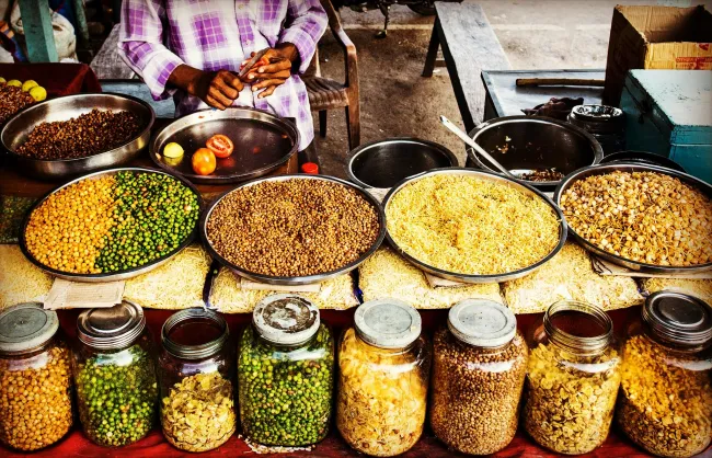 Photo of a food stand with different food in glass jars. Credit: NEOSiAM 2024 via pexels.