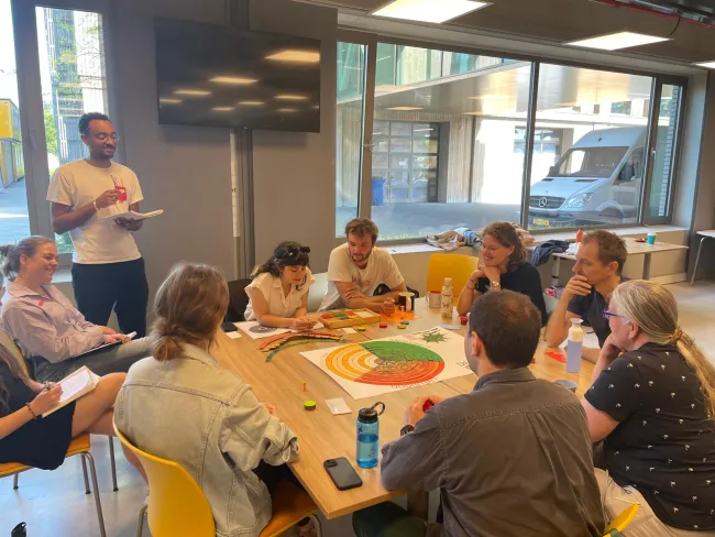 Provided by Frederico Andreotti for his Essay on Games on TABLE, pictures a group playing the student game 'Who Got The Power?', sent 30 April 2025