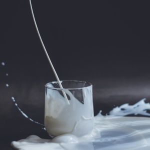 Glass of spilt milk. Photo by Anita Jankovic via Unsplash