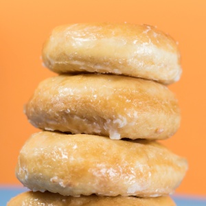 A pile of sugar coated doughnuts. Photo by Kyle Brinker via Unsplash.