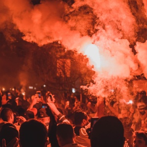 Image of a riot at night. Photo by Maurício Mascaro via Pexels.