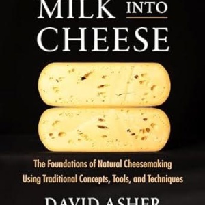 Title page of book 'milk into cheese' with picture of round cheese cut in half