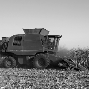 Photo of a combine harvester in black and white. Credit Alex Rusin via pexels