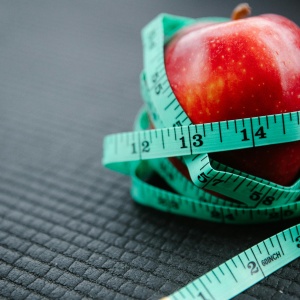 Photo of apple with tape measurer. Credit: Annushka Ahuja